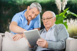 Companion care at home offers socialization, encouragement, and help with tasks that may be difficult for them, like technology.